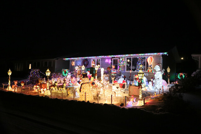 Beautiful display of Christmas lights decorating a festive house.