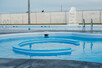 Smaller swim up area in larger pool.