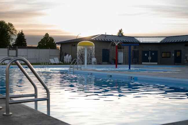 Splash feature running in pool, shot at dusk.