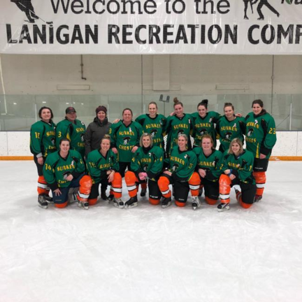 Lanigan ladies hockey charity group shot on rink ice.