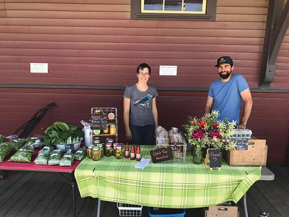 Two local vendors at the Farmer's Market.