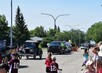 Classic vehicles decorated with balloons as part of the parade.