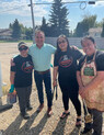 MP Tolmie posing with volunteers.