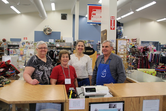 Four volunteers at Gift & Thrift shop.