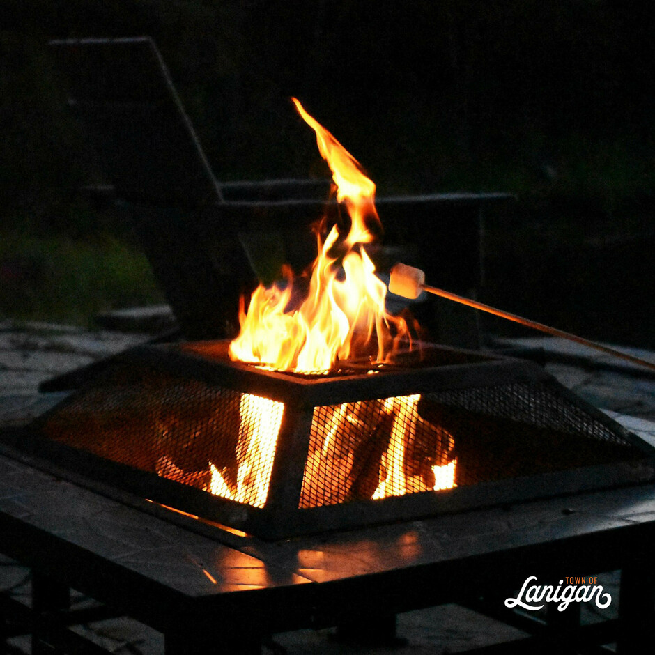 Roasting a marshmallow over a bonfire in an appropriate receptacle.